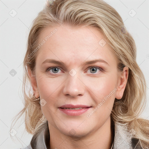 Joyful white young-adult female with medium  brown hair and blue eyes