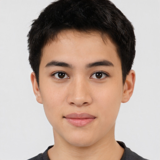 Joyful latino young-adult male with short  brown hair and brown eyes