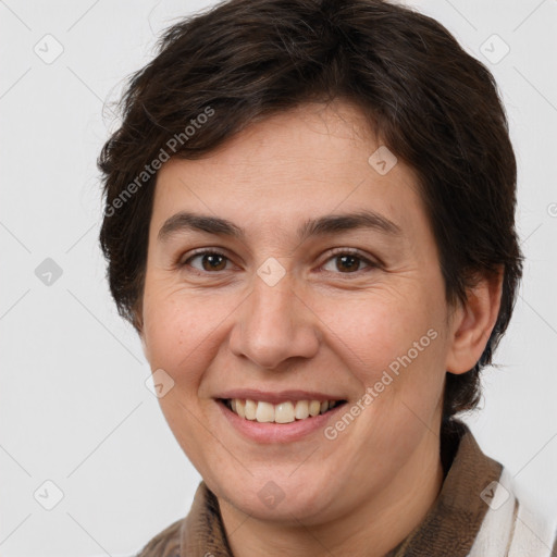 Joyful white adult female with medium  brown hair and brown eyes