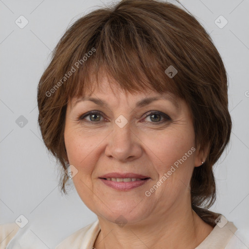 Joyful white adult female with medium  brown hair and brown eyes