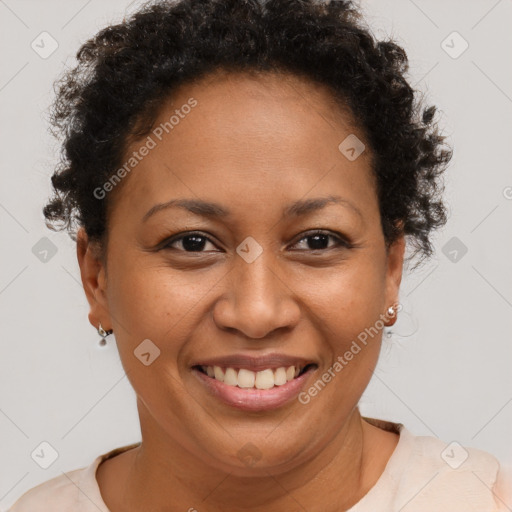 Joyful black adult female with short  brown hair and brown eyes