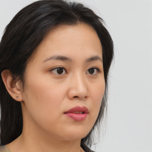 Neutral asian young-adult female with medium  brown hair and brown eyes