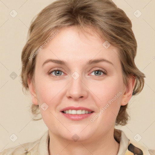 Joyful white young-adult female with medium  brown hair and blue eyes