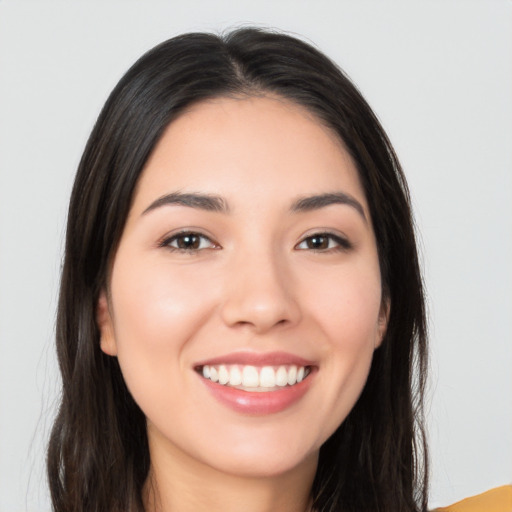 Joyful white young-adult female with long  black hair and brown eyes