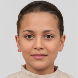 Joyful white child female with short  brown hair and brown eyes