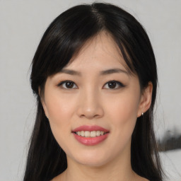 Joyful asian young-adult female with long  black hair and brown eyes