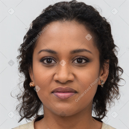 Joyful black young-adult female with long  brown hair and brown eyes