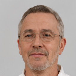 Neutral white middle-aged male with short  gray hair and brown eyes