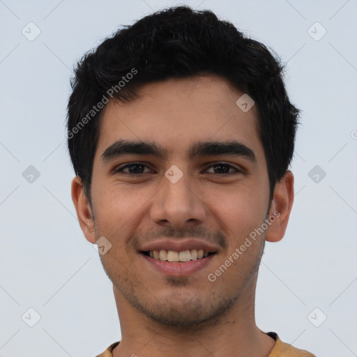 Joyful white young-adult male with short  black hair and brown eyes