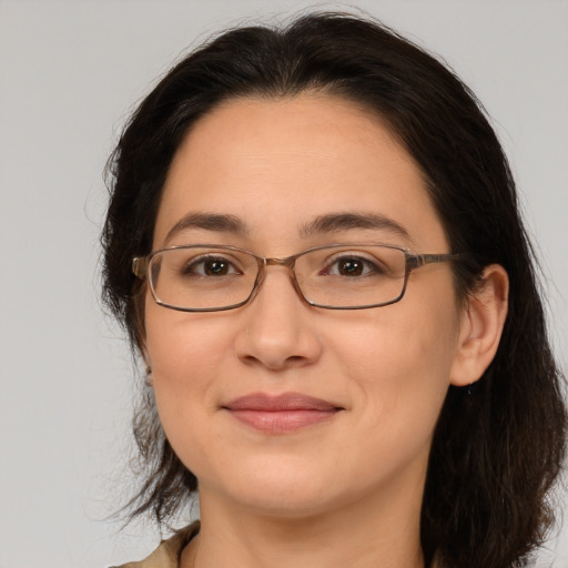 Joyful white adult female with medium  brown hair and brown eyes