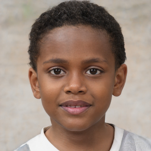 Joyful black child male with short  brown hair and brown eyes