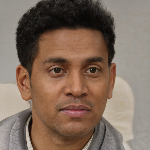 Neutral latino young-adult male with short  brown hair and brown eyes
