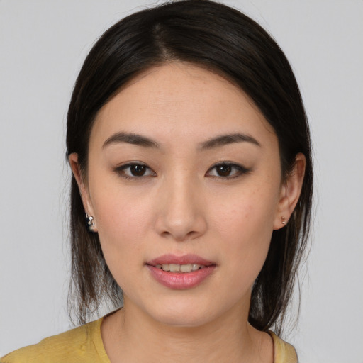 Joyful white young-adult female with medium  brown hair and brown eyes