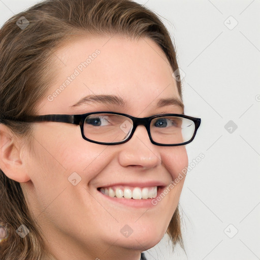 Joyful white young-adult female with long  brown hair and blue eyes