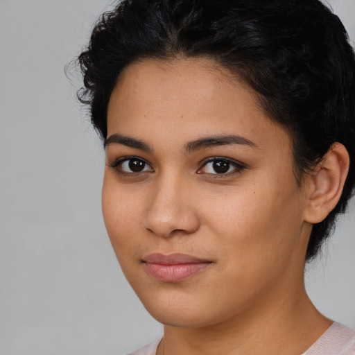 Joyful latino young-adult female with short  brown hair and brown eyes