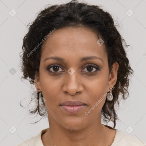 Joyful black young-adult female with medium  brown hair and brown eyes