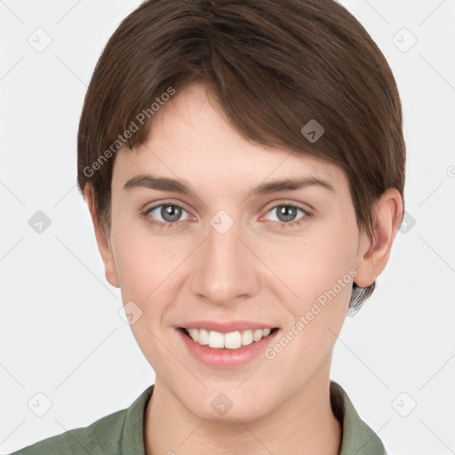 Joyful white young-adult female with short  brown hair and grey eyes