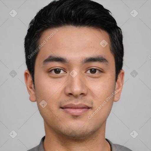 Joyful asian young-adult male with short  black hair and brown eyes