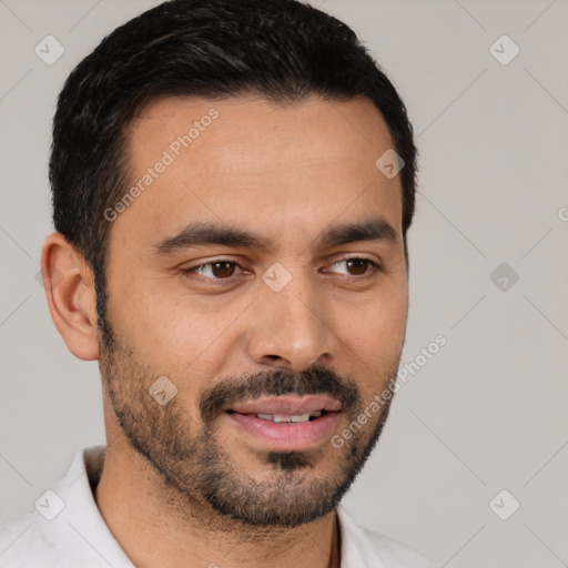 Joyful white young-adult male with short  black hair and brown eyes