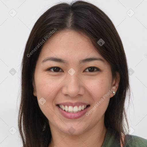 Joyful white young-adult female with long  brown hair and brown eyes