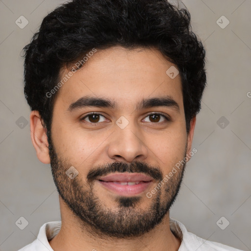 Joyful latino young-adult male with short  black hair and brown eyes