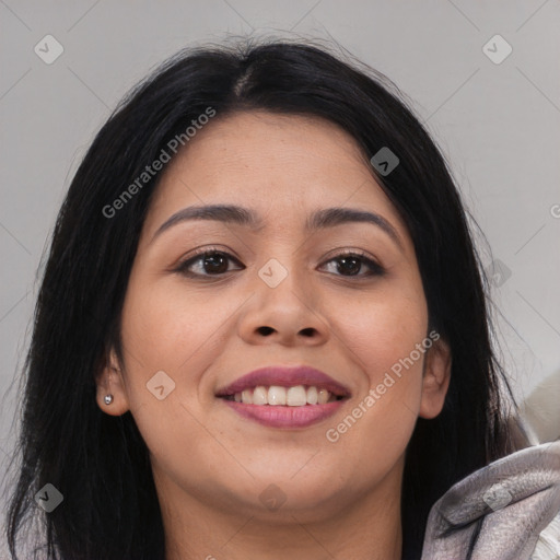 Joyful latino young-adult female with long  black hair and brown eyes