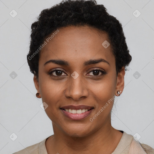 Joyful black young-adult female with short  black hair and brown eyes