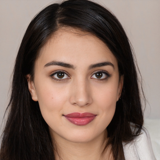 Joyful white young-adult female with long  brown hair and brown eyes