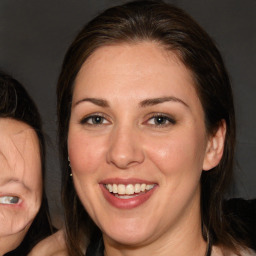 Joyful white adult female with long  brown hair and brown eyes