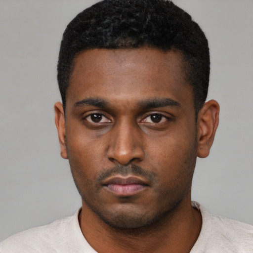 Neutral black young-adult male with short  black hair and brown eyes
