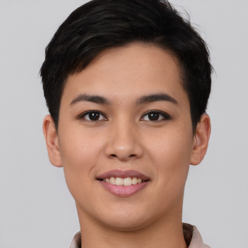 Joyful asian young-adult female with short  black hair and brown eyes