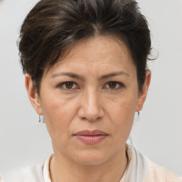 Joyful white adult female with short  brown hair and brown eyes
