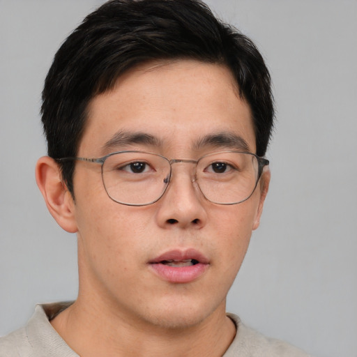 Neutral asian young-adult male with short  brown hair and brown eyes
