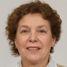 Joyful white middle-aged female with medium  brown hair and brown eyes