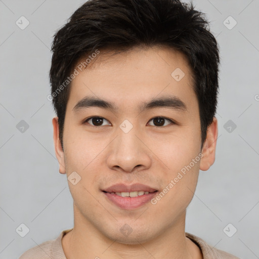 Joyful asian young-adult male with short  brown hair and brown eyes