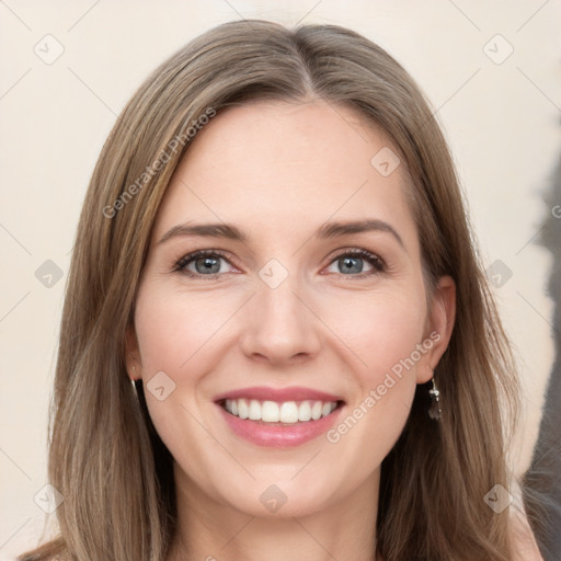 Joyful white young-adult female with long  brown hair and grey eyes