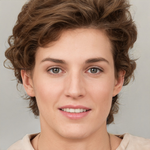 Joyful white young-adult female with medium  brown hair and green eyes