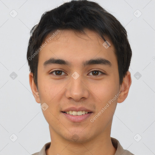 Joyful asian young-adult male with short  brown hair and brown eyes