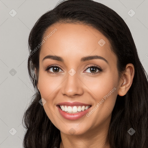 Joyful latino young-adult female with long  black hair and brown eyes