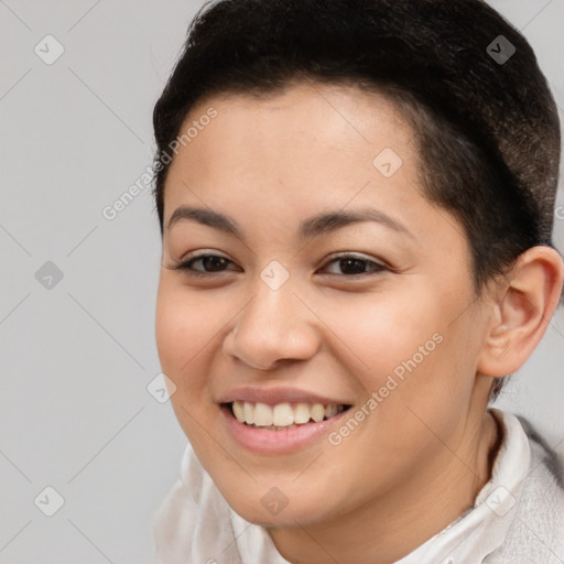 Joyful latino young-adult female with short  brown hair and brown eyes