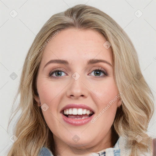 Joyful white young-adult female with long  brown hair and blue eyes