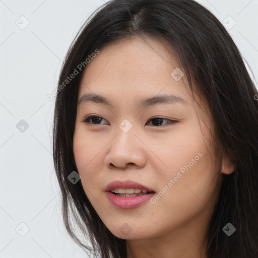 Joyful asian young-adult female with long  brown hair and brown eyes