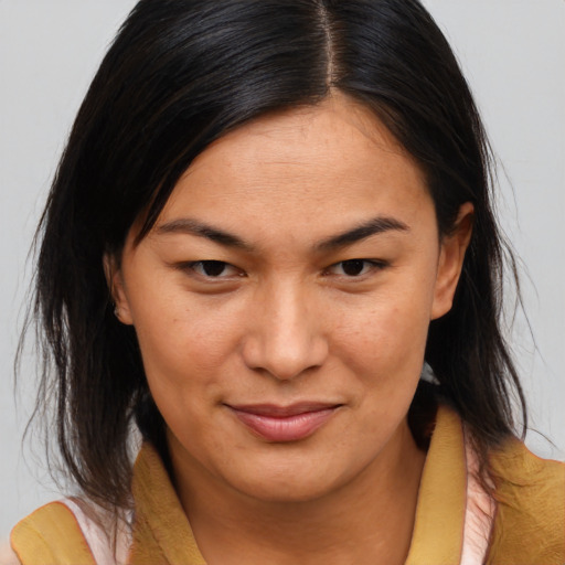 Joyful asian young-adult female with medium  brown hair and brown eyes