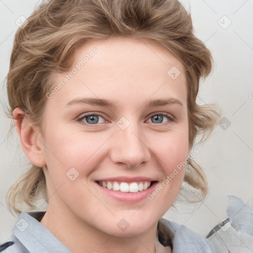 Joyful white young-adult female with medium  brown hair and blue eyes