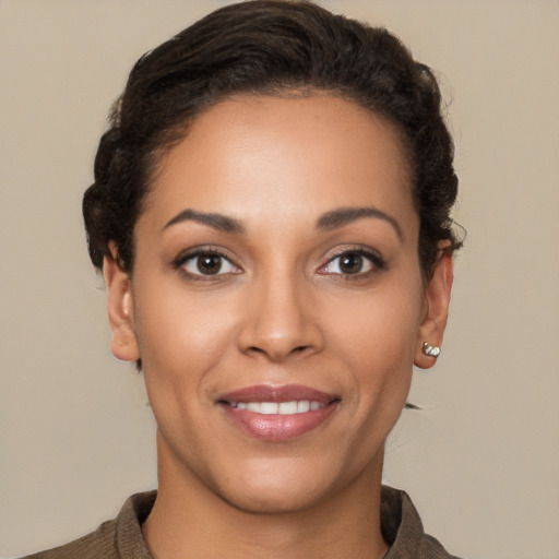 Joyful latino young-adult female with short  brown hair and brown eyes