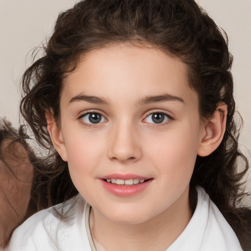 Joyful white child female with medium  brown hair and brown eyes