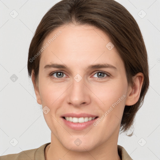 Joyful white young-adult female with medium  brown hair and grey eyes