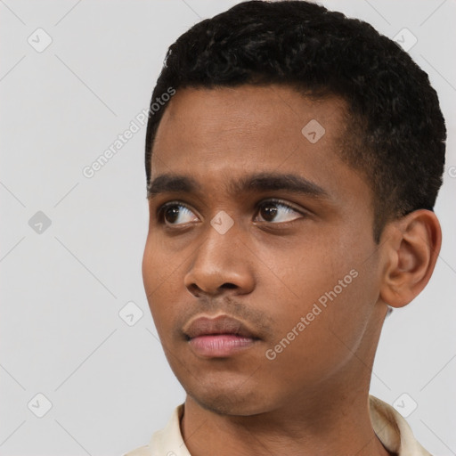 Neutral latino young-adult male with short  black hair and brown eyes