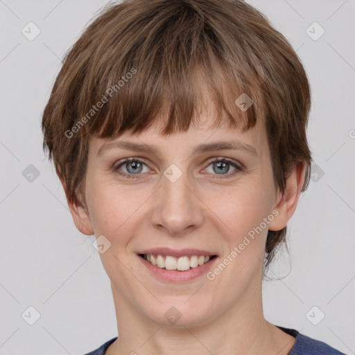 Joyful white young-adult female with medium  brown hair and grey eyes