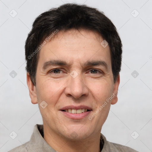 Joyful white adult male with short  brown hair and brown eyes